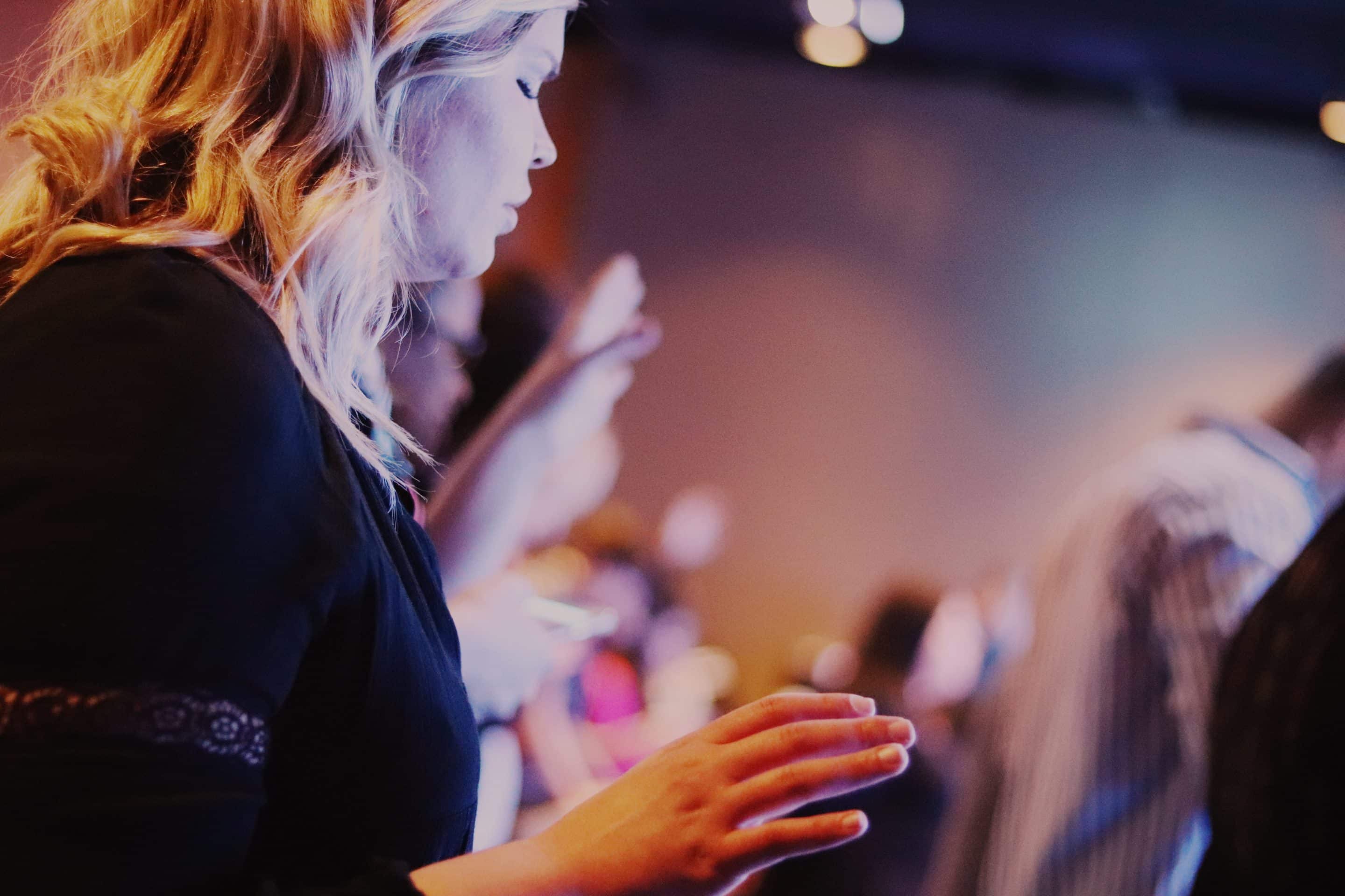 A woman worshipping Jesus and being saturated by the presence of God